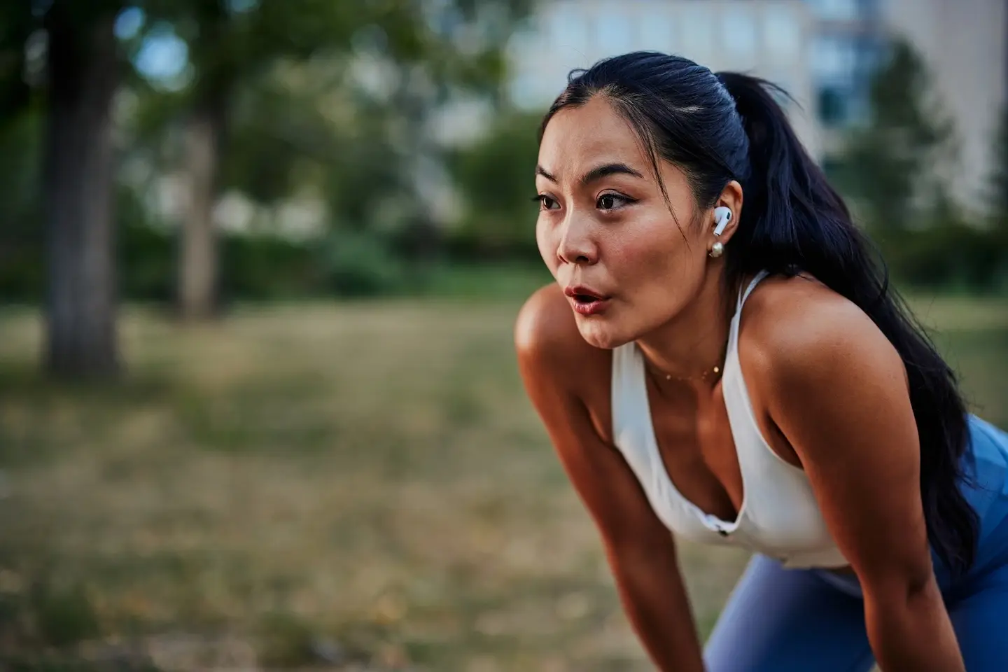 Woman exercising outdoors in Georgetown, Texas, focused and determined representing healthy weight loss and sustainable lifestyle practices.